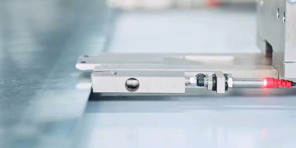 Close-up of the punching station and sheet feed on a turret puncher