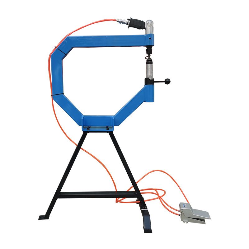 Pneumatic planishing hammer on a stand with foot pedal