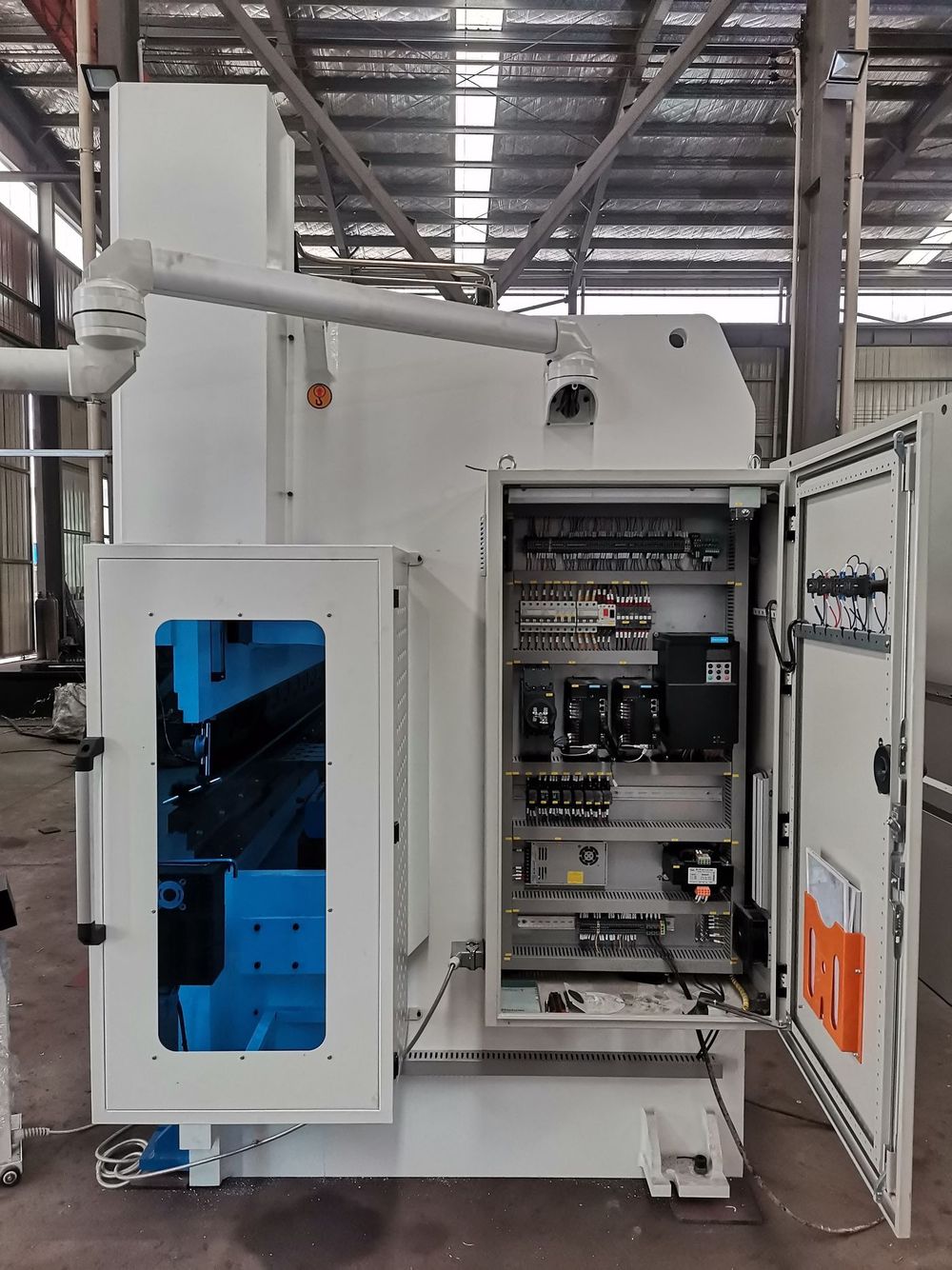 Open electrical cabinet of a press brake with servo drives and control circuits