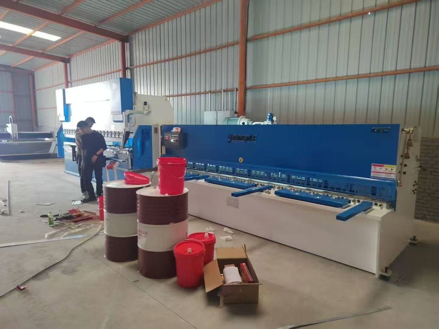 Commissioning team checking the ram and tooling on the 110T press brake