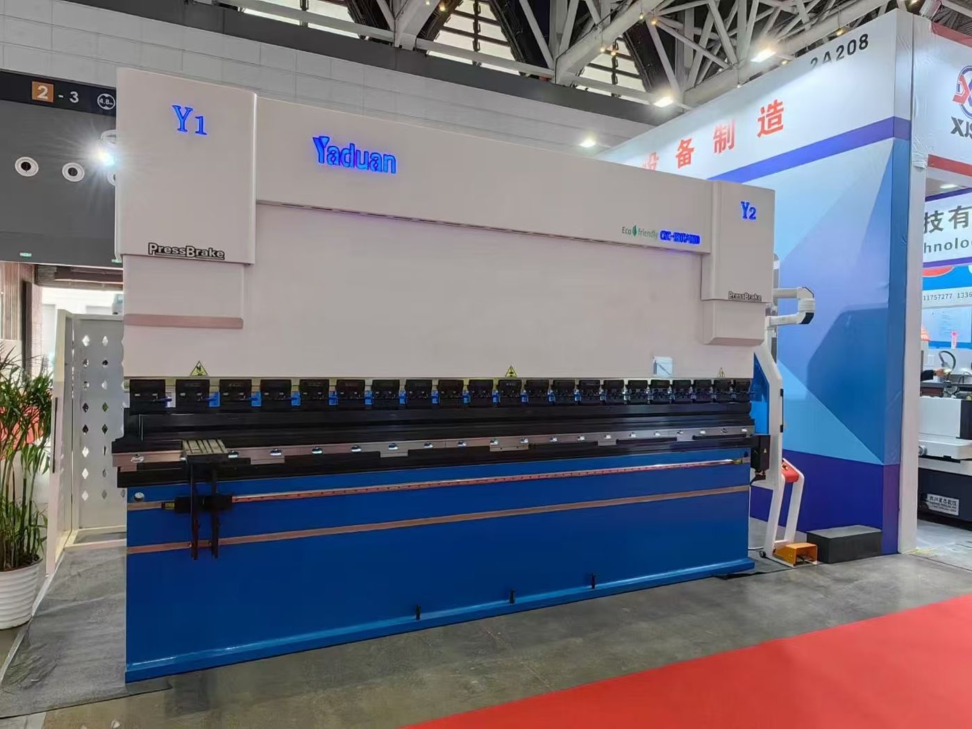 Press brake tooling and control panel detail at the booth